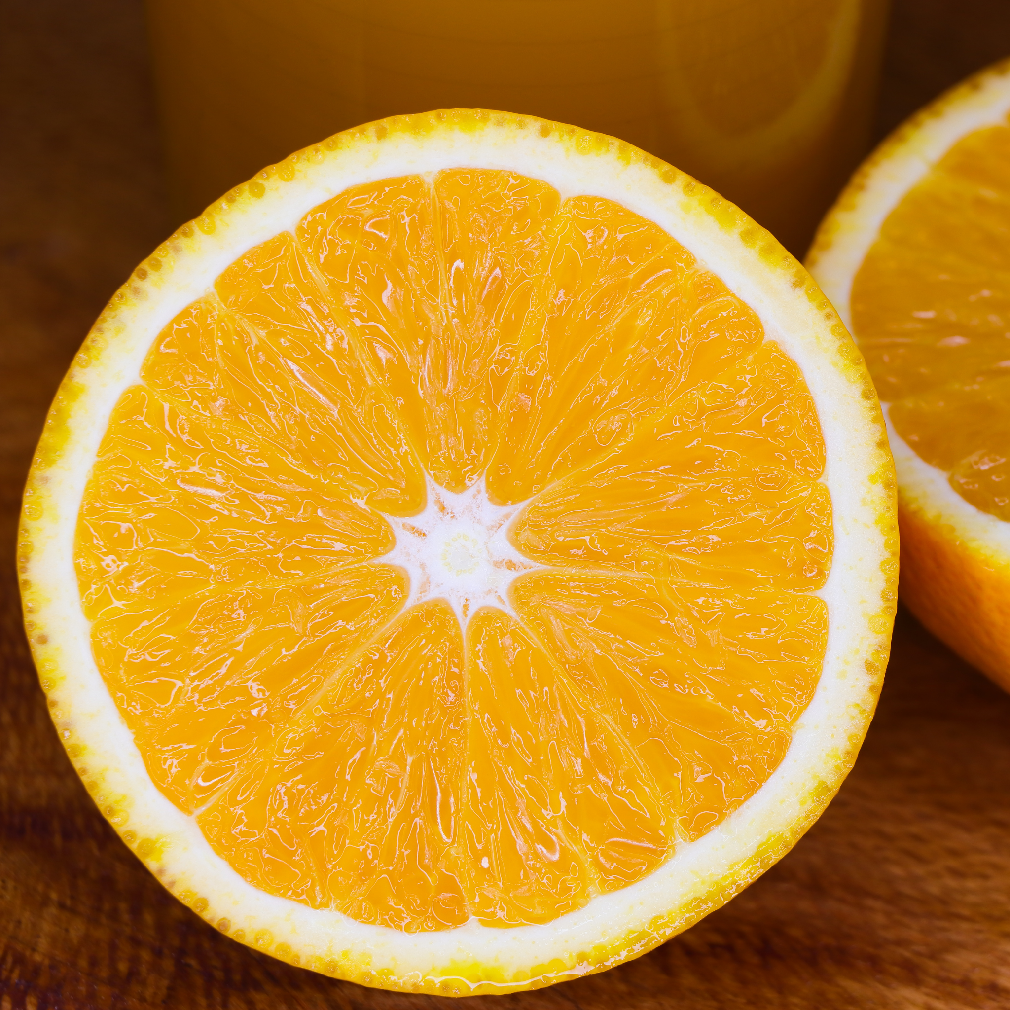 Close-up of a sliced orange on a wooden surface